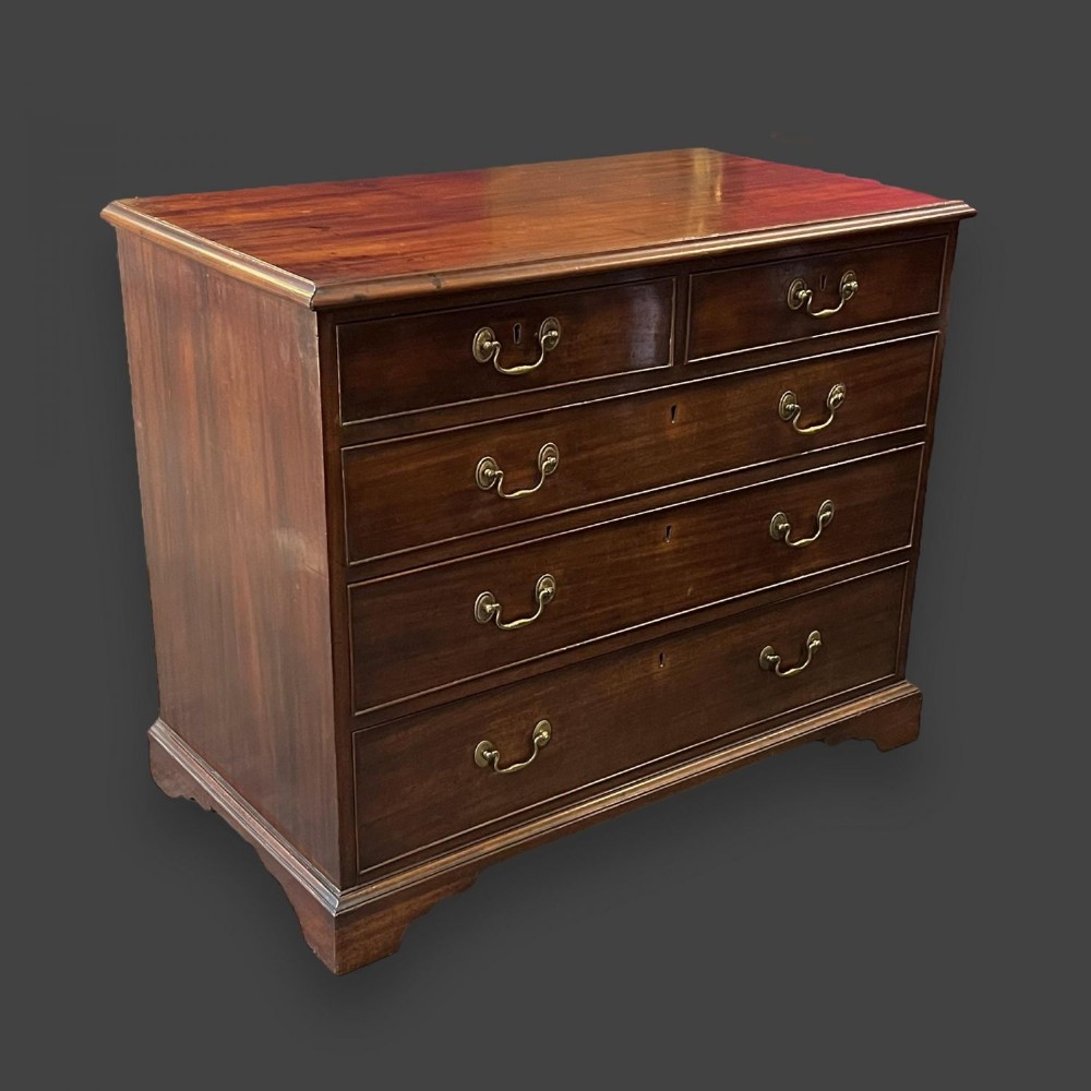 A small scale George III Period mahogany chest of drawers