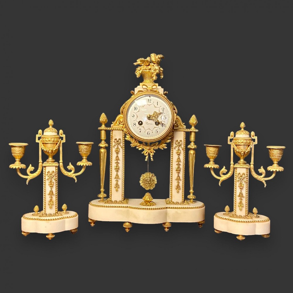 A fine quality French Late 19th Century marble and ormolu mounted garniture de cheminee