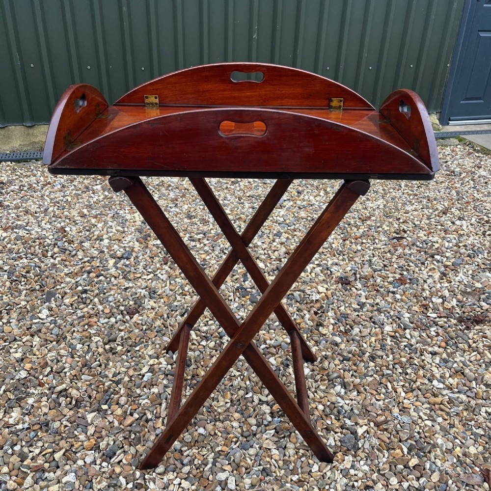 A Georgian period mahogany butlers tray on stand.