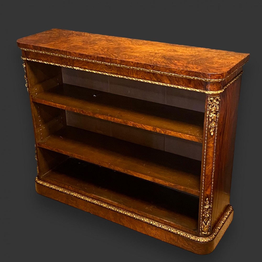 A beautiful Victorian Period burr walnut and parcel gilt open bookcase.