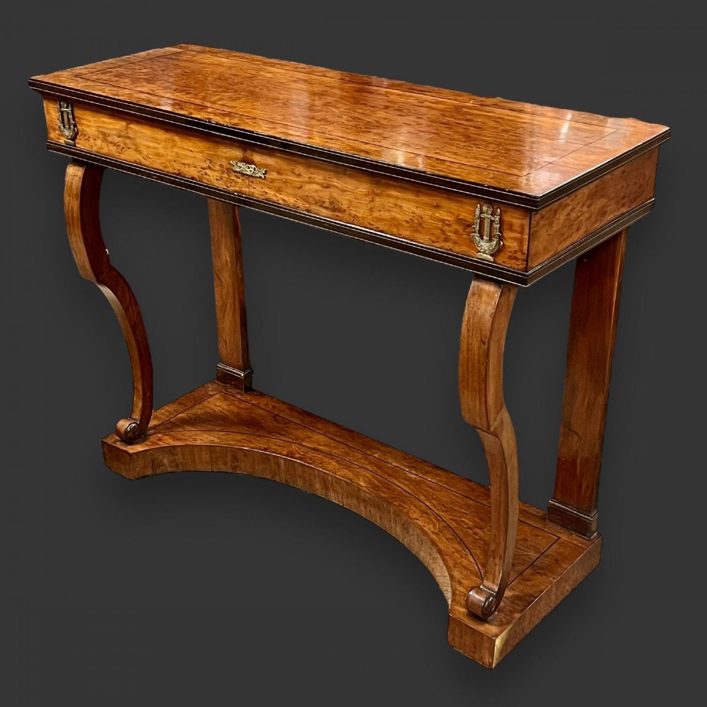 A French Empire Period plum pudding mahogany console table