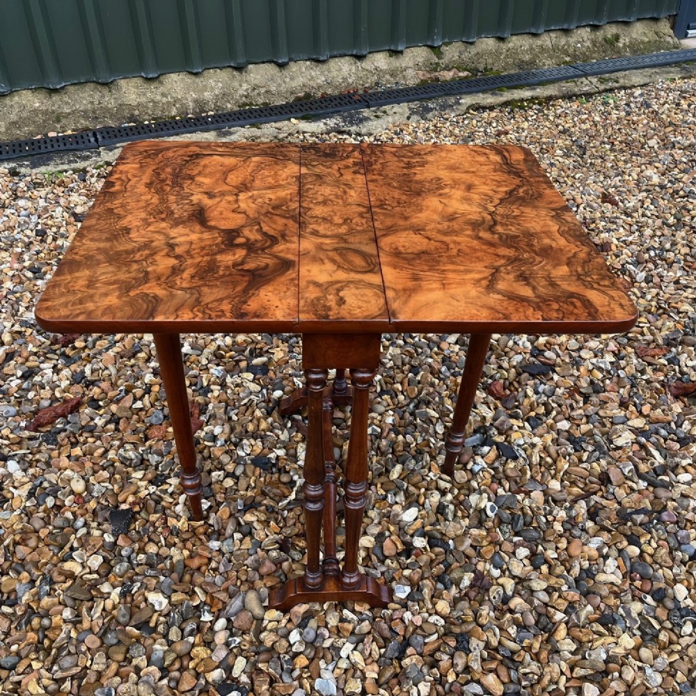 A Victorian Period burr walnut baby Sutherland table