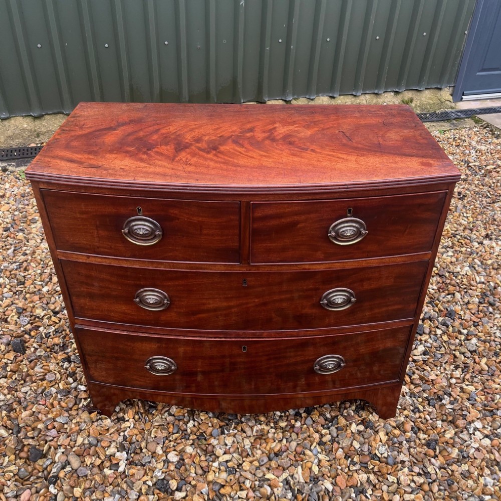 A small Regency Period mahogany bow front chest