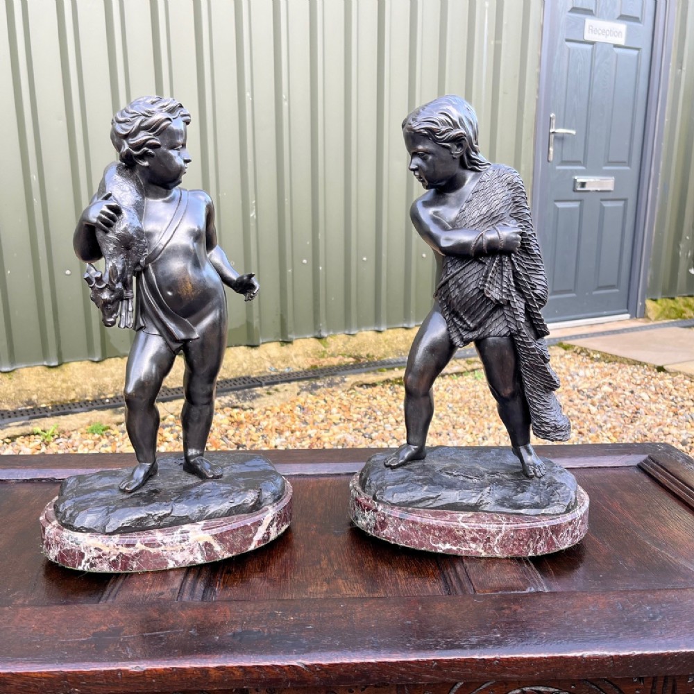 A beautiful pair of French 19th Century bronze cherubs 