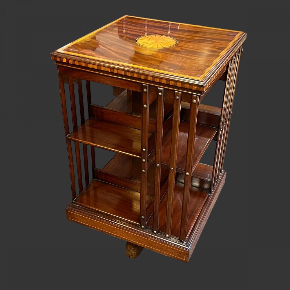 An Edwardian period mahogany inlaid revolving bookcase.