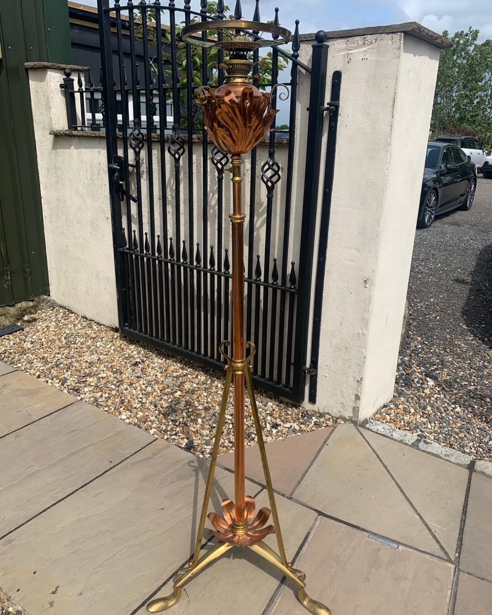 An Arts & Crafts Period brass and copper adjustable oil lamp