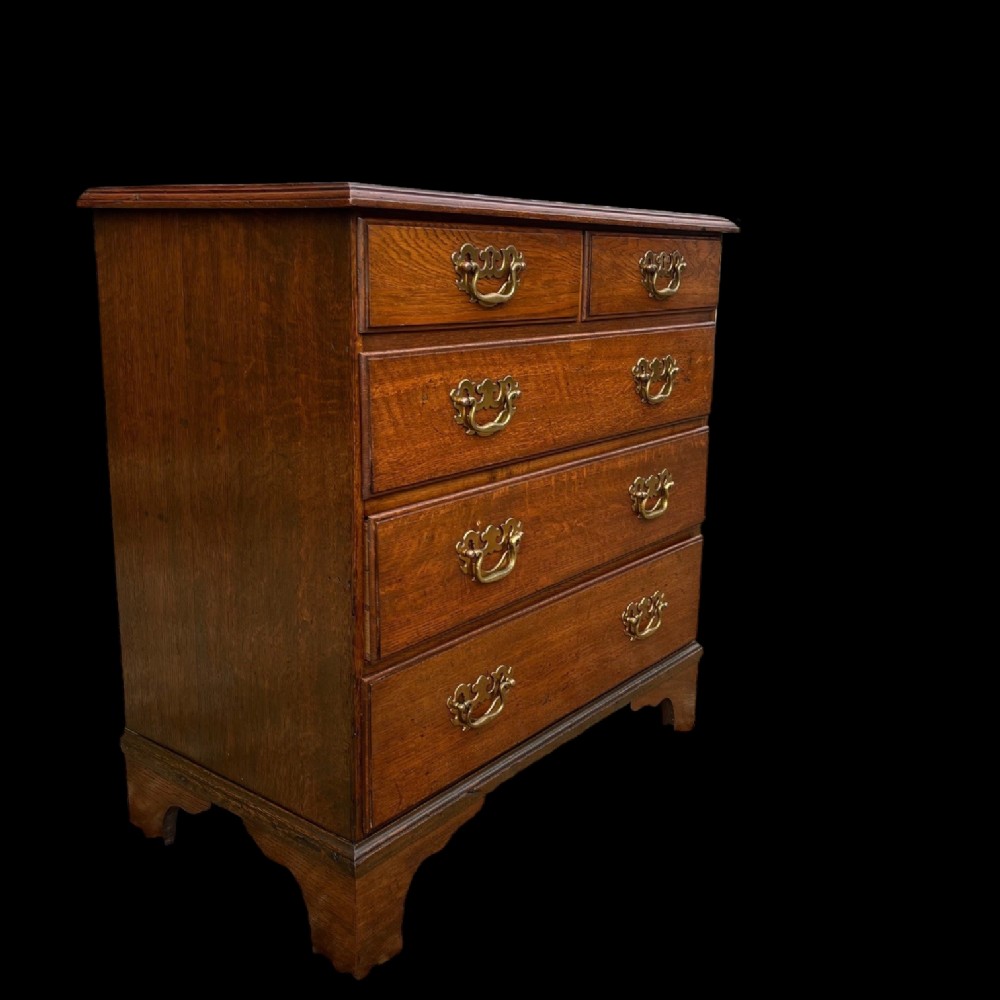 A small scale George III Period oak chest of drawers.
