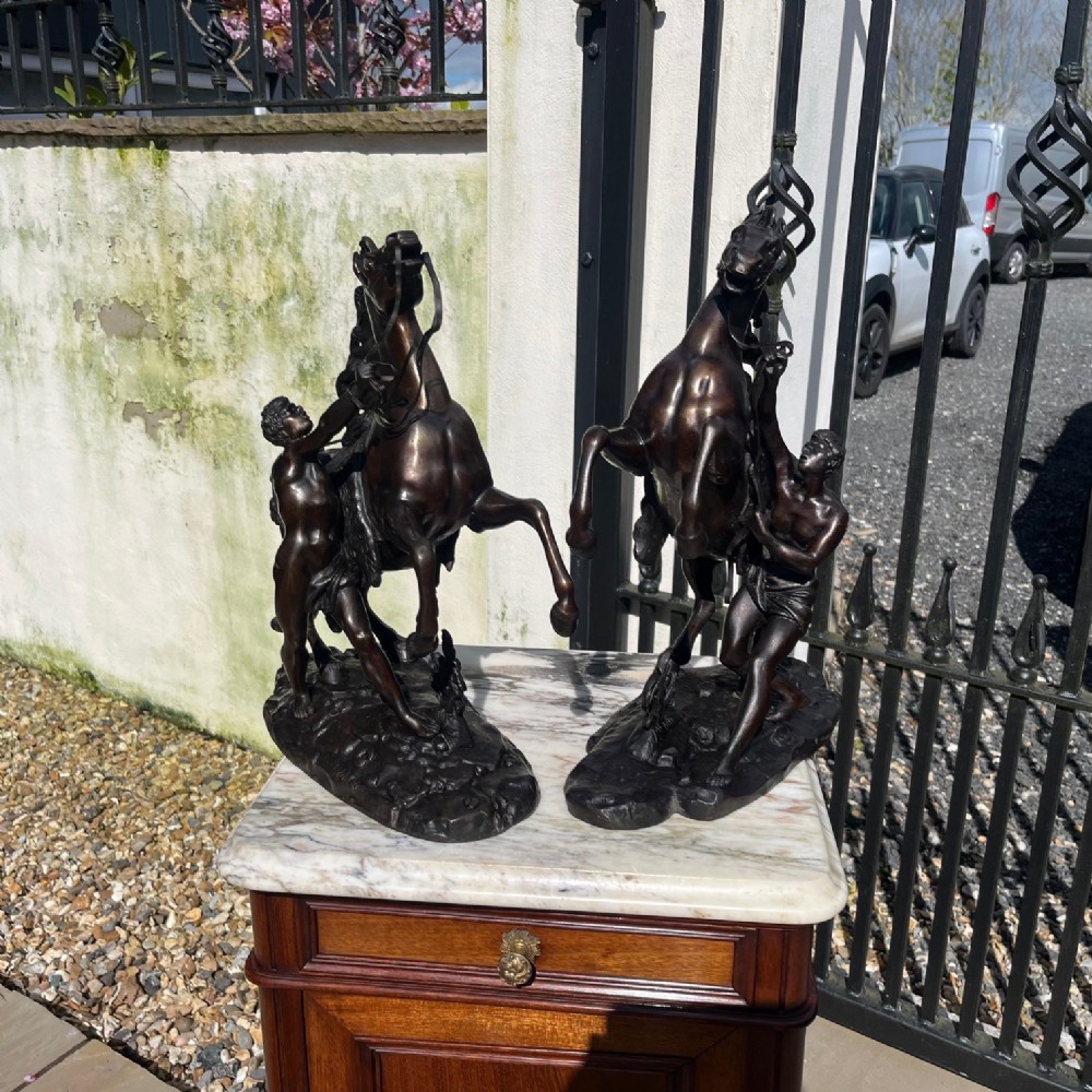 A pair of French Classical 19th Century bronze Marley horses by Coustou 