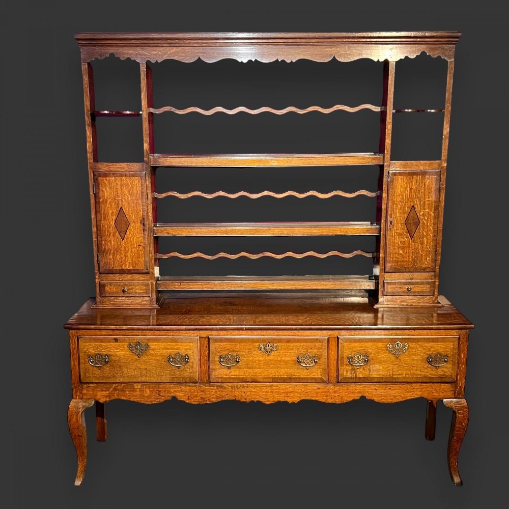 A George III Period oak dresser and rack