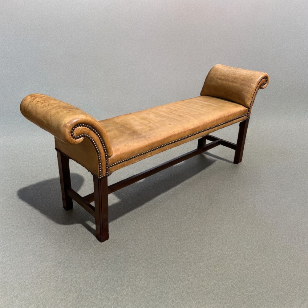 A Georgian Style mahogany and leather window seat
