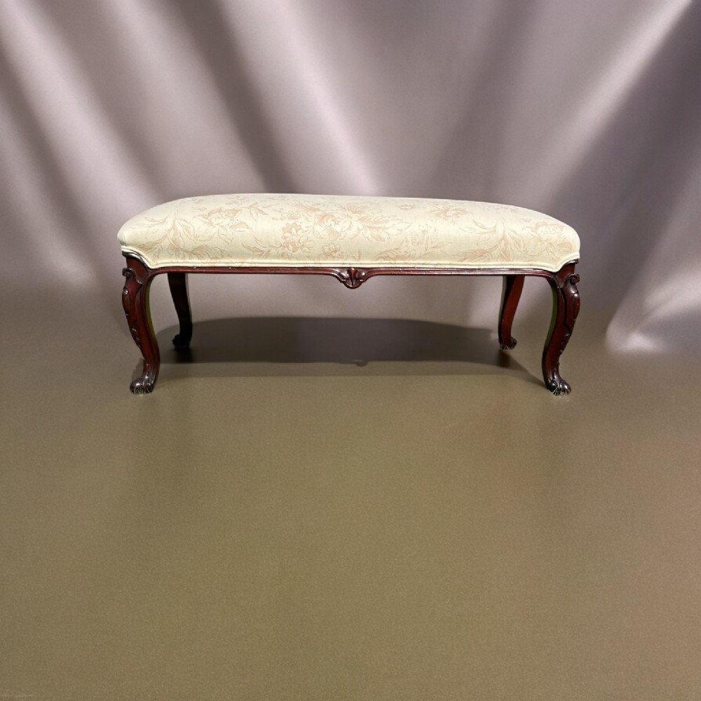 A Victorian Period mahogany rectangular stool with finely