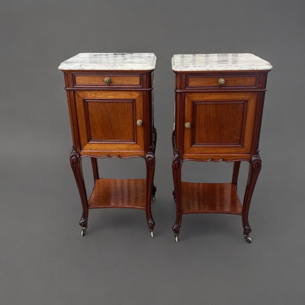 A Superb Quality pair of French mahogany bedside cabinets