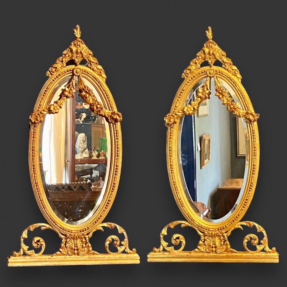 A fine quality pair of gilt wood and gesso antique pier mirrors