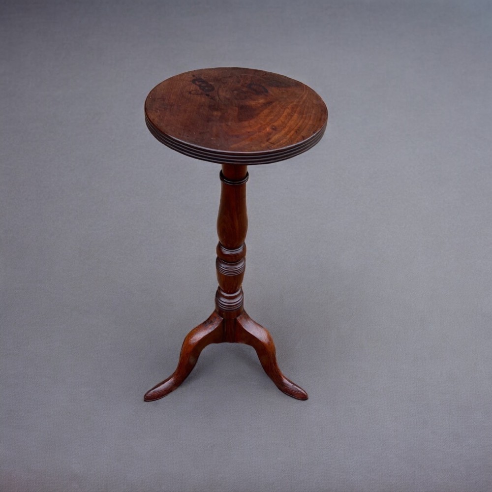 A George III Period mahogany antique candle stand