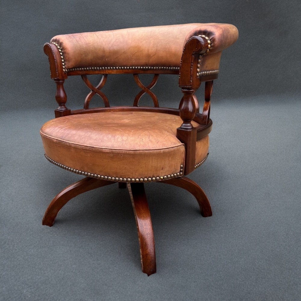 A super quality Edwardian Period mahogany and leather desk chair