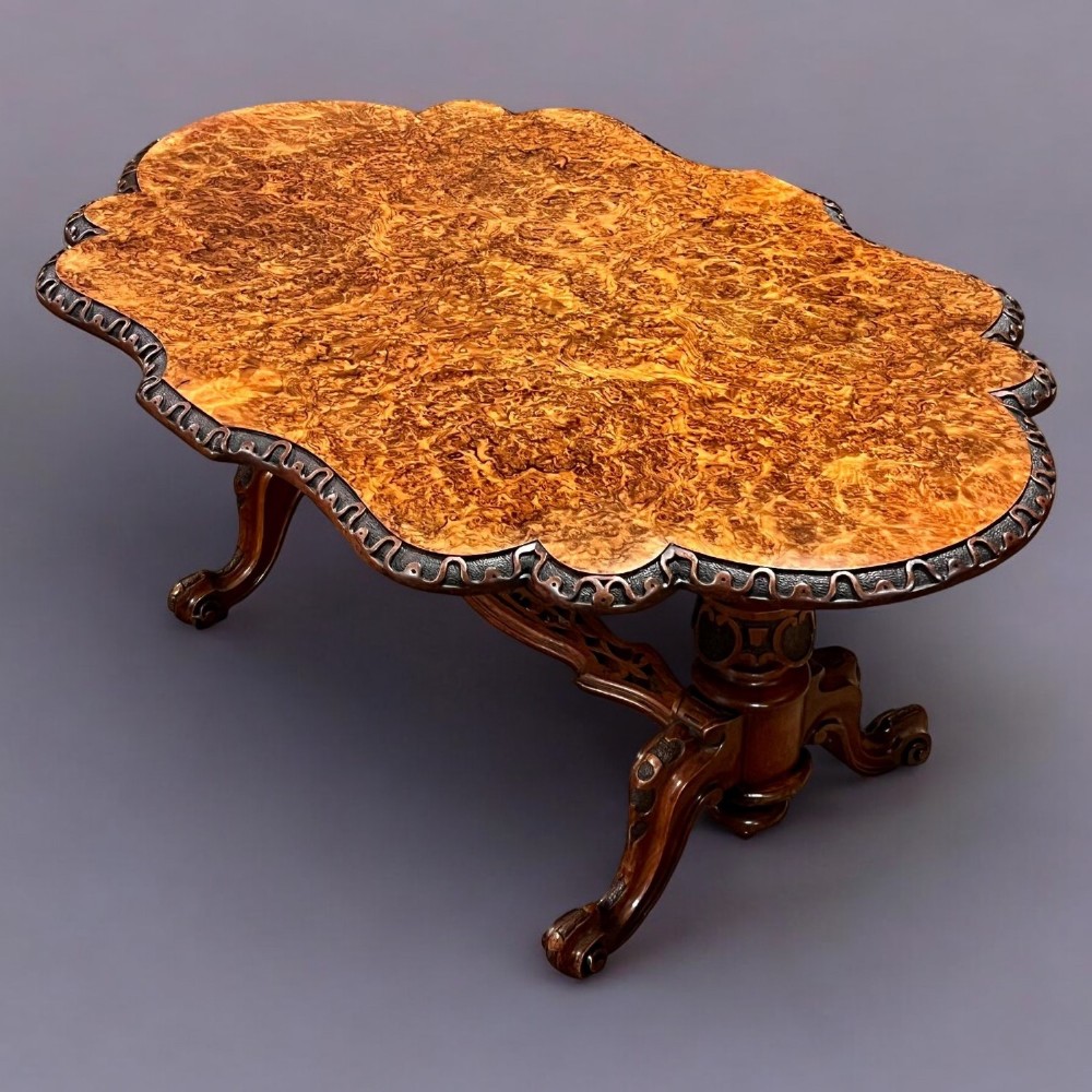 A beautiful Victorian Period burr walnut shaped coffee table