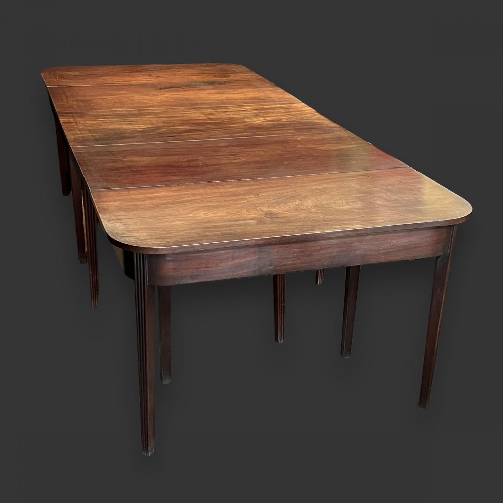 A good multi functional George III Period mahogany dining table
