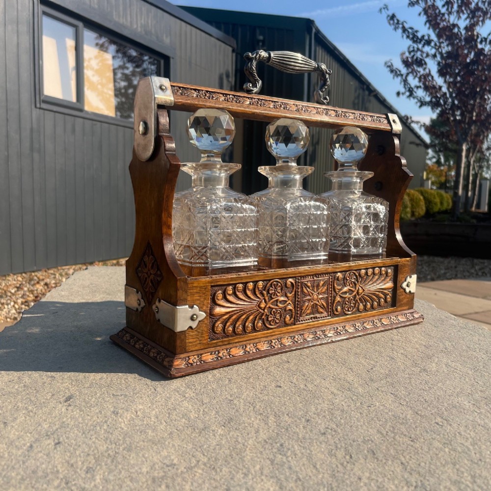 A Late Victorian Period oak tantalus