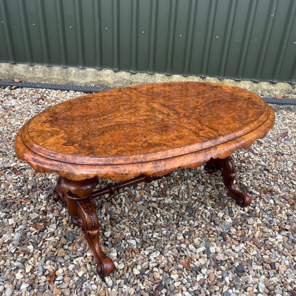 A fine quality Victorian Period burr walnut oval coffee table