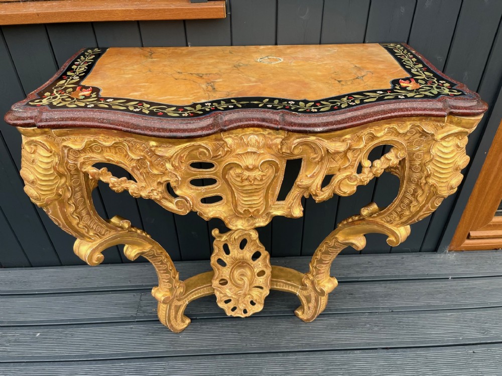 A fine quality Louis XV style carved gilt wood and marble console table