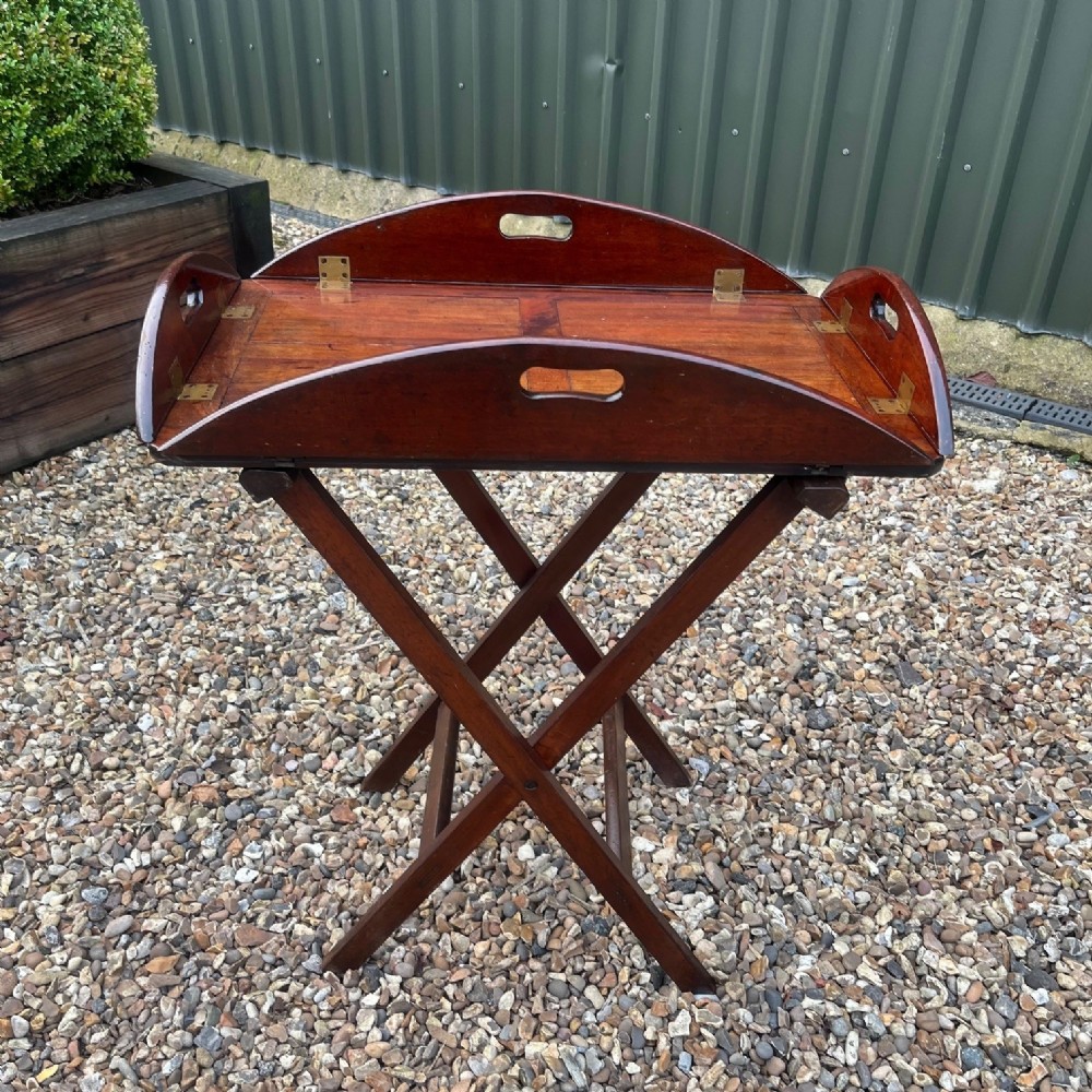 A Regency Period mahogany butlers tray on stand