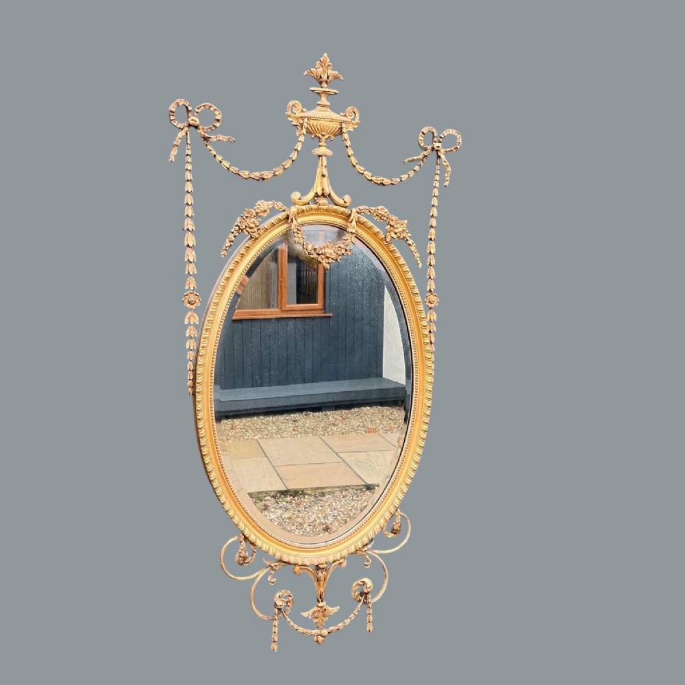 A fine quality Adam Revival carved gilt wood and gesso pier mirror