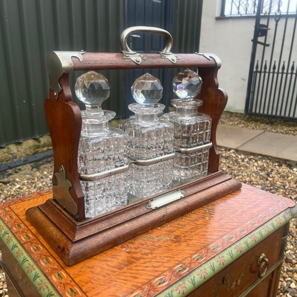 A Late Victorian Period oak tantalus.