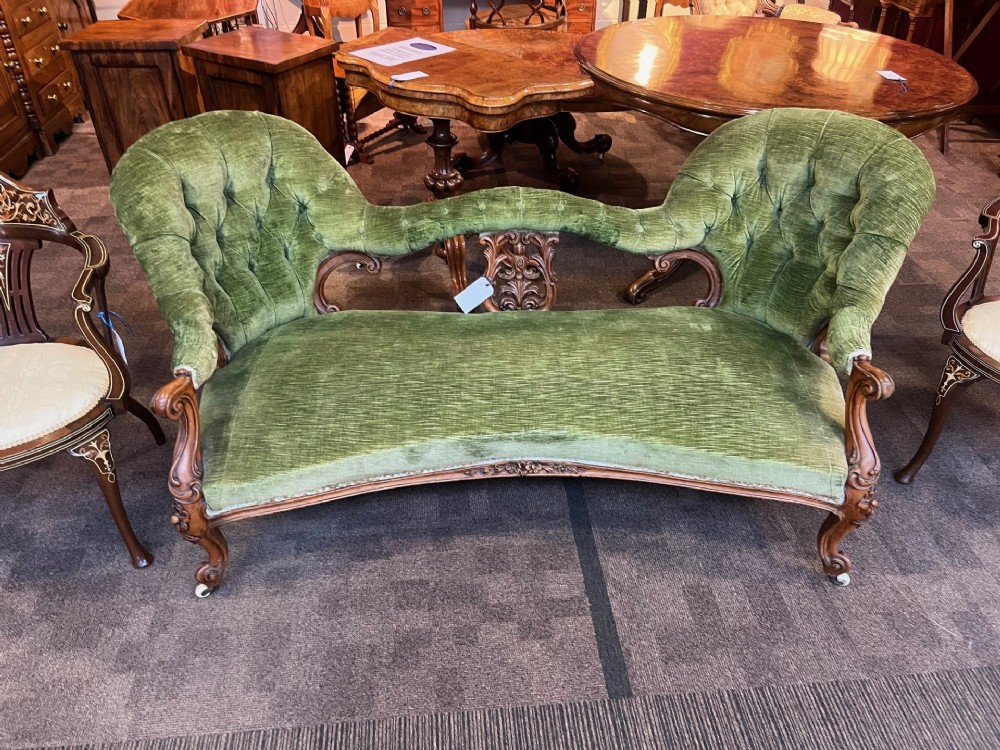 A Victorian Period walnut sofa