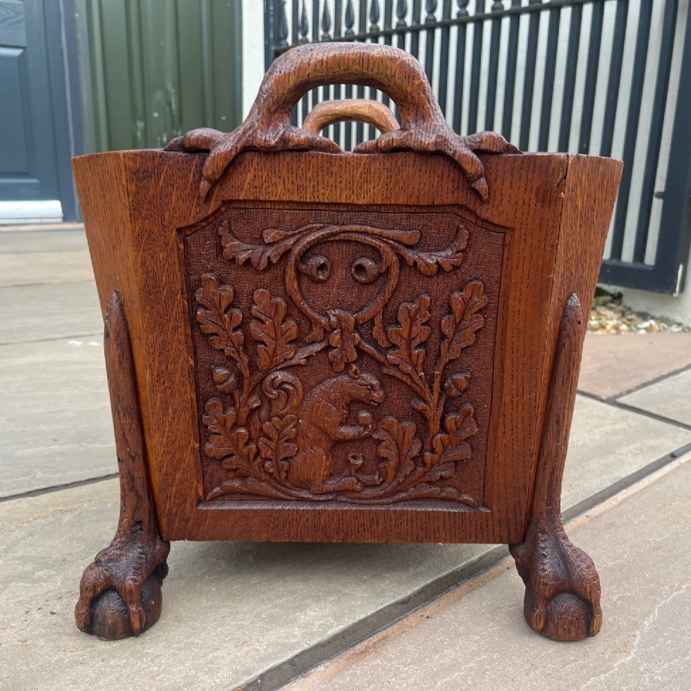 A Charming Country House oak waste paper basket.