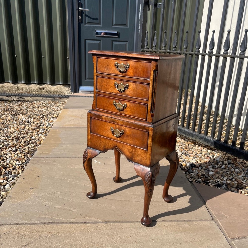 A fine quality small scale George I Style walnut chest on stand