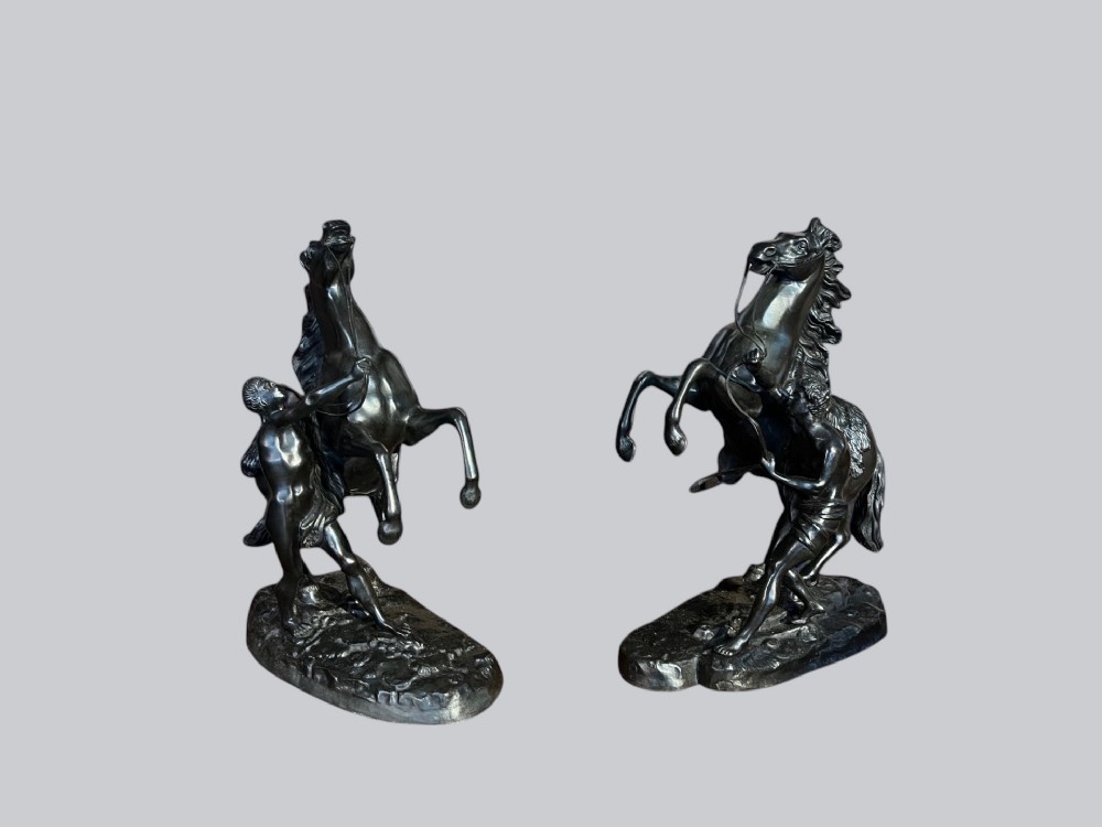 A pair of French Classical 19th Century bronze Marley horses