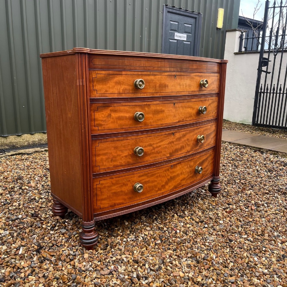 A fine quality large Regency Period mahogany bow front chest