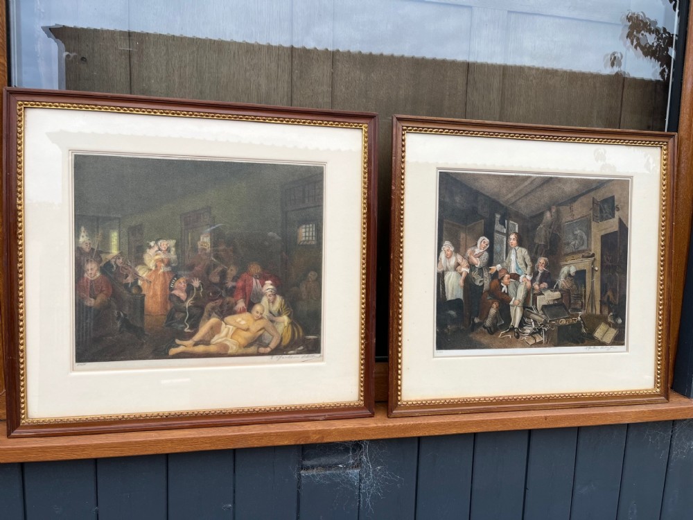 A set of framed hand-coloured stipple engravings depicting eighteenth-century interior scenes in dark wood frames with beaded gilt slips.