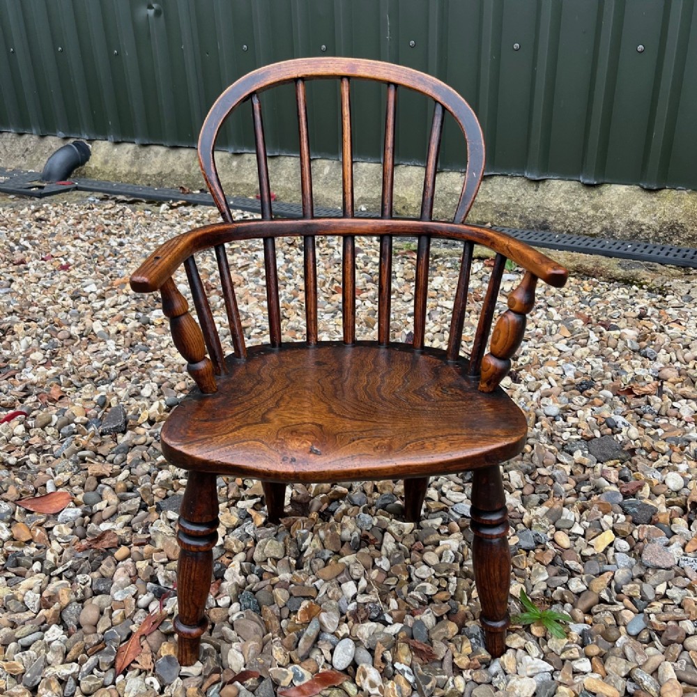 A Mid 19th Century Childs elm Windsor arm chair