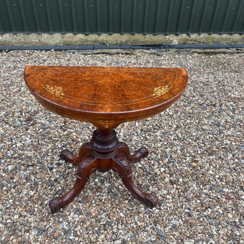 A Victorian Period burr walnut and walnut fold over games table