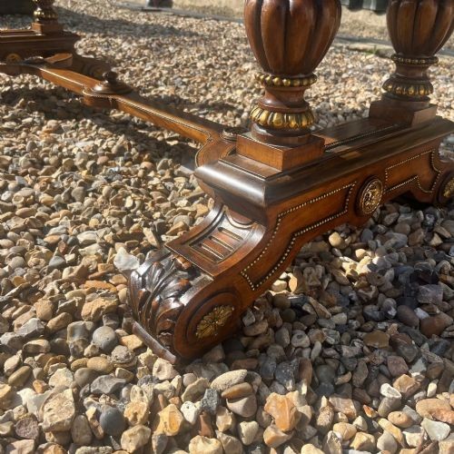 A Victorian burr walnut library table with shaped ends, fluted dual end supports, a low stretcher, and gilded ormolu mounts. View VII