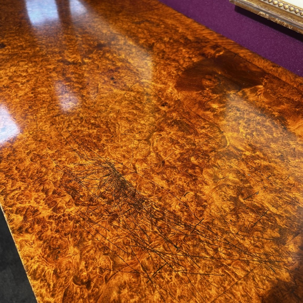 An early Victorian Goncalo Alves and amboyna low bookcase credenza featuring glazed doors and carved corbels. View VII
