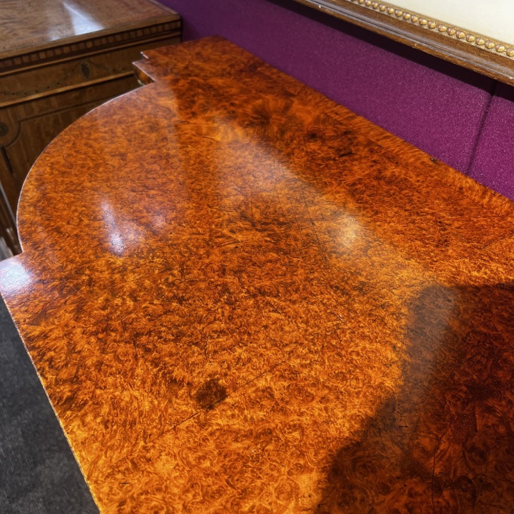 An early Victorian Goncalo Alves and amboyna low bookcase credenza featuring glazed doors and carved corbels. View VIII