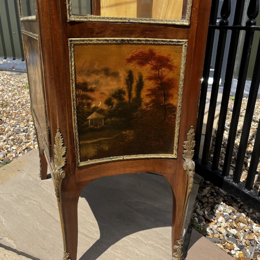 A French Louis XV style mahogany display cabinet featuring glazed sides, gilt bronze mounts, a marble top, and a lower hand-painted Vernis Martin panel. View II