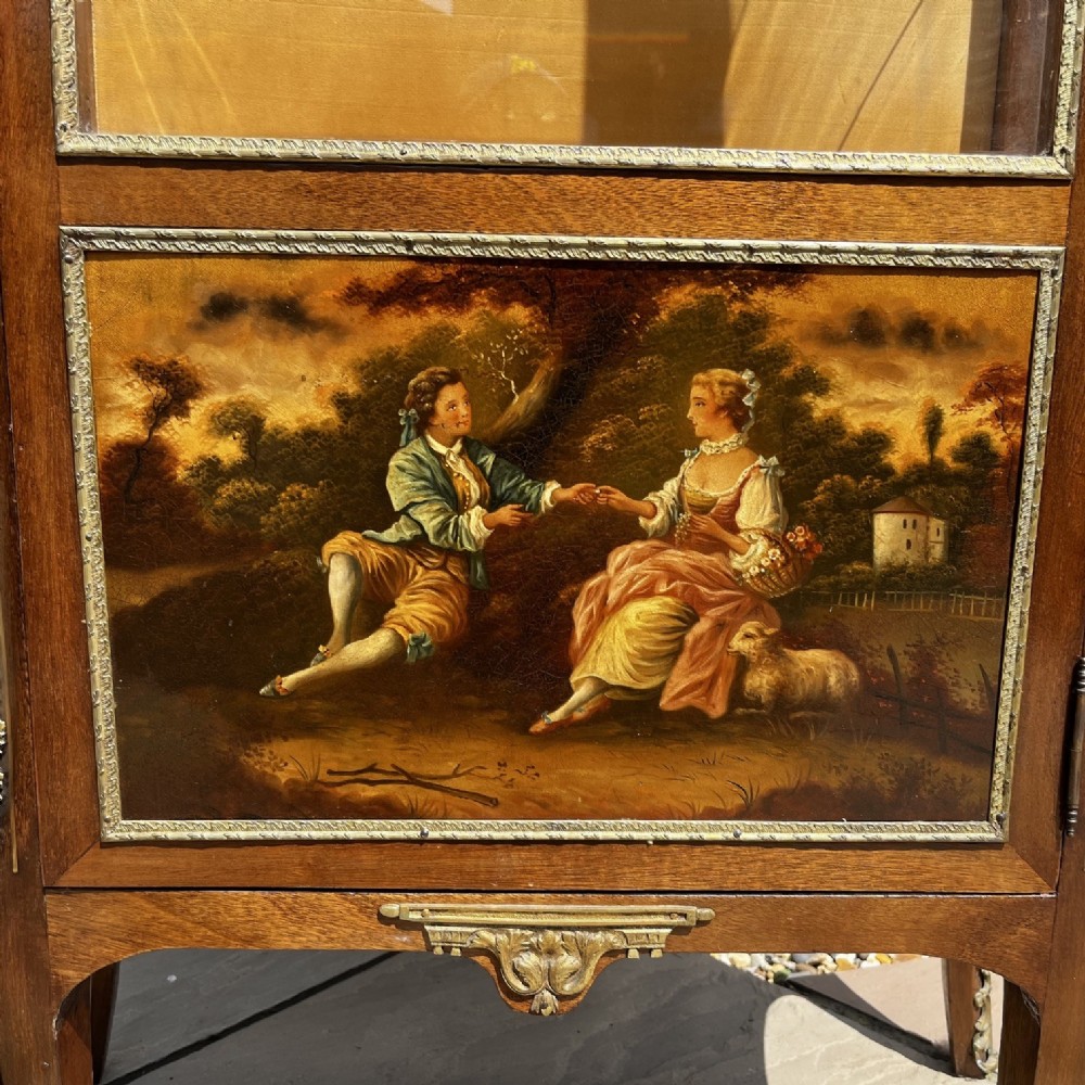 A French Louis XV style mahogany display cabinet featuring glazed sides, gilt bronze mounts, a marble top, and a lower hand-painted Vernis Martin panel. View III