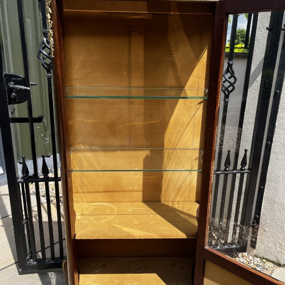 A French Louis XV style mahogany display cabinet featuring glazed sides, gilt bronze mounts, a marble top, and a lower hand-painted Vernis Martin panel. View V