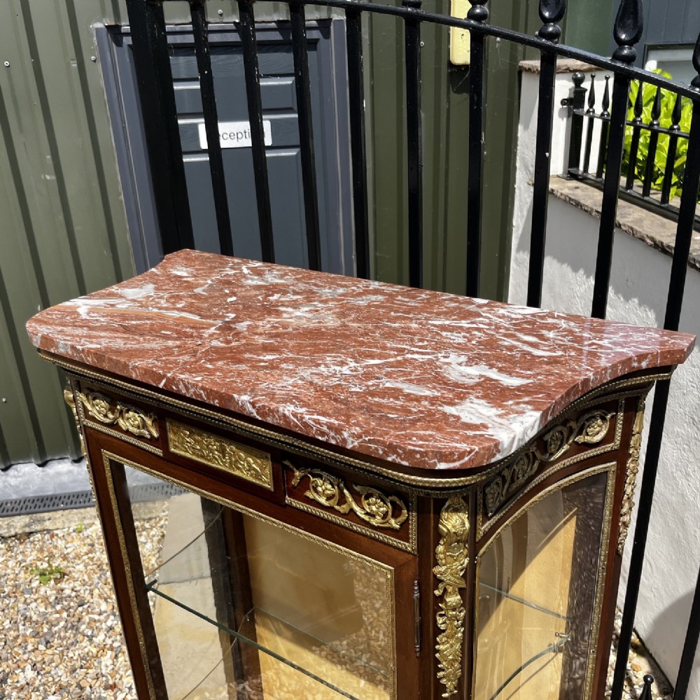 A French Louis XV style mahogany display cabinet featuring glazed sides, gilt bronze mounts, a marble top, and a lower hand-painted Vernis Martin panel. View VIII