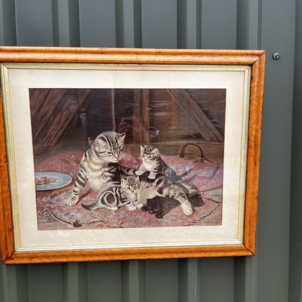 A 19th Century Chromolithograph depicting a mother cat and her kittens, titled 