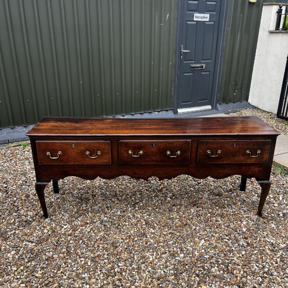 A George III Period Oak Three Drawer Dresser Base. View II