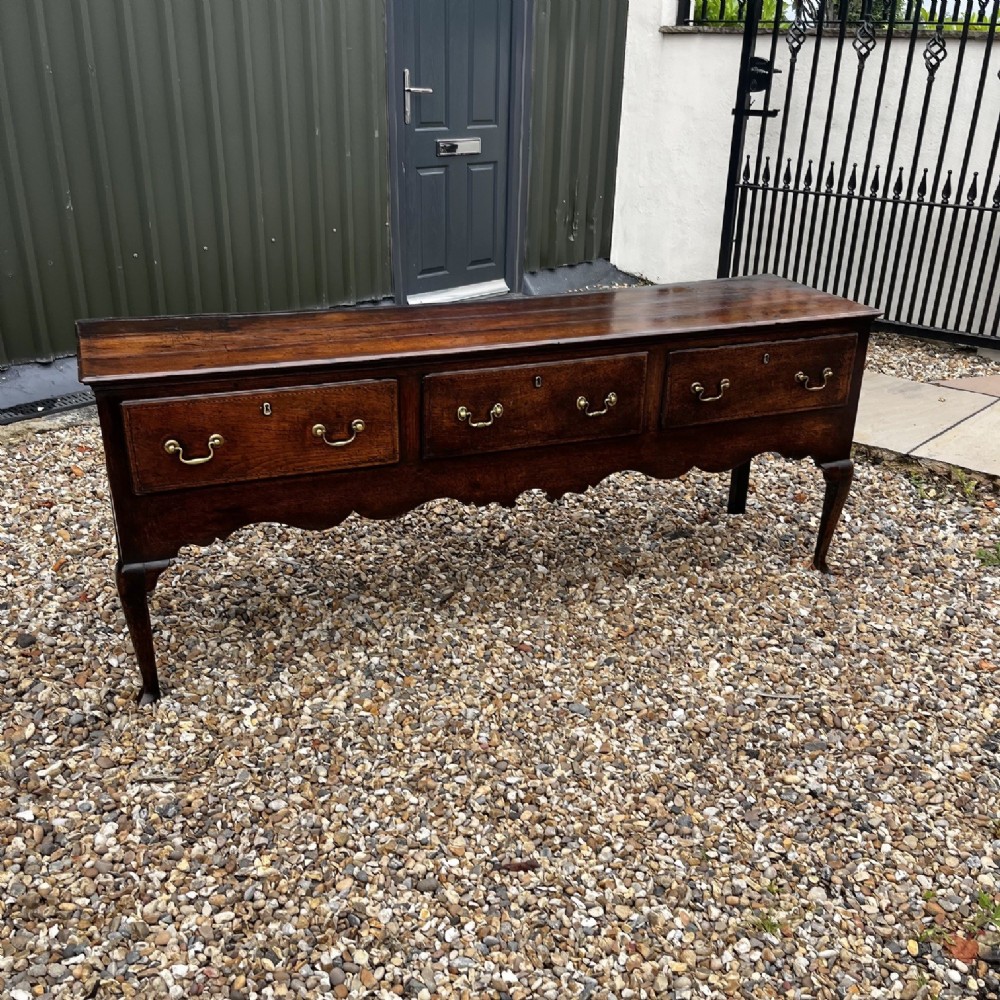 A George III Period Oak Three Drawer Dresser Base. View IV