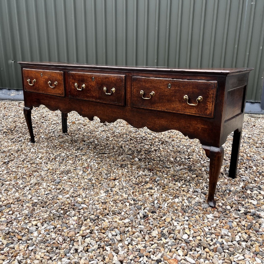 A George III Period Oak Three Drawer Dresser Base. View VI