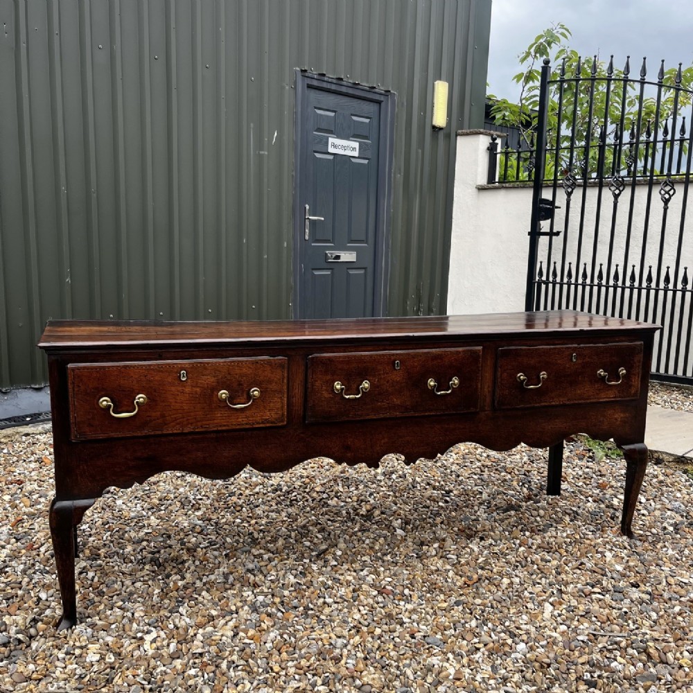 A George III Period Oak Three Drawer Dresser Base. View VII