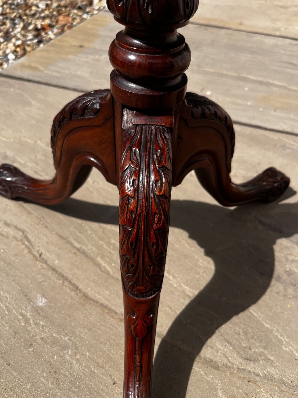 A 19th-century mahogany tripod occasional table featuring a circular polished top, turned central stem, and three carved cabriole legs. View III