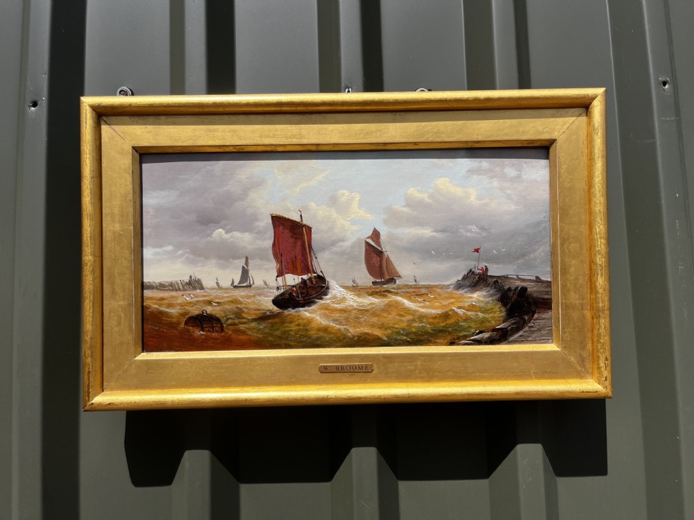 A pair of Victorian marine oil paintings depicting sailing ships on choppy coastal waters, framed in matching gilded rectangular frames with brass nameplates. View II