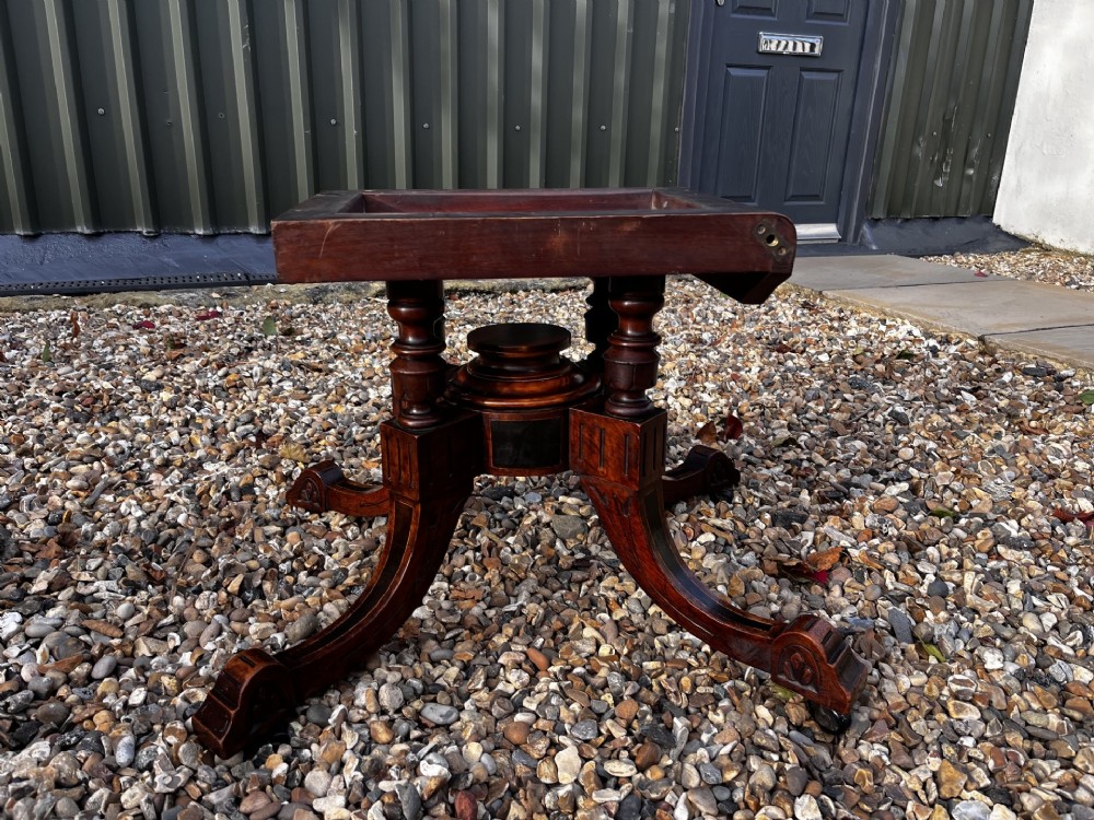 An octagonal Victorian burr walnut low coffee table with central floral marquetry inlay and splayed legs. View II